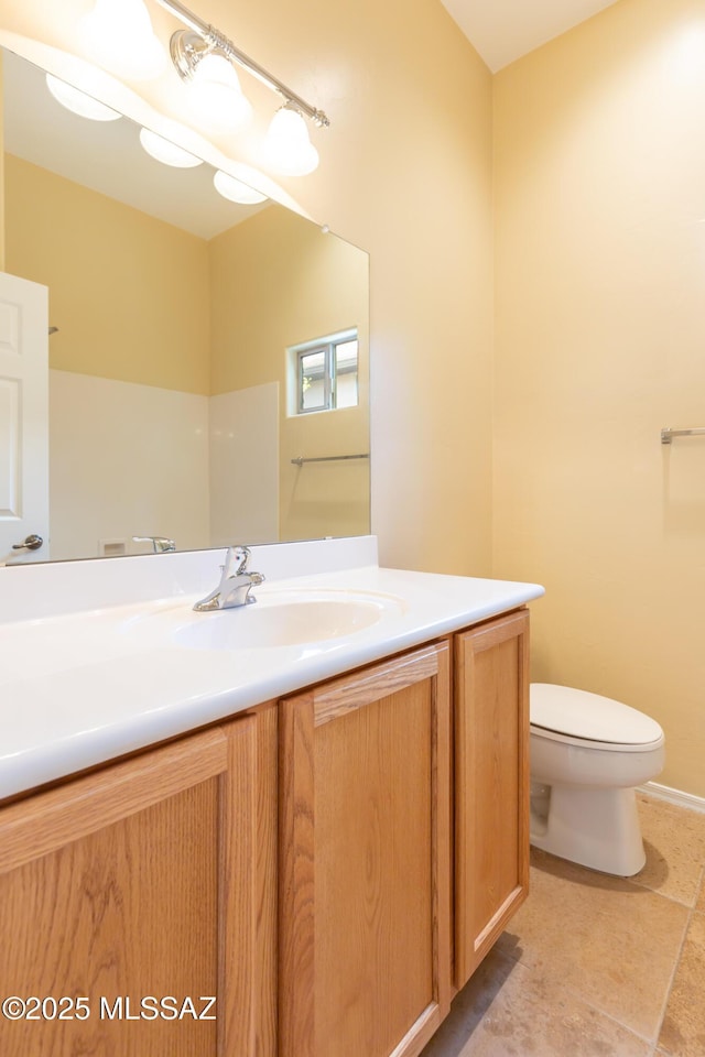 bathroom featuring toilet and vanity