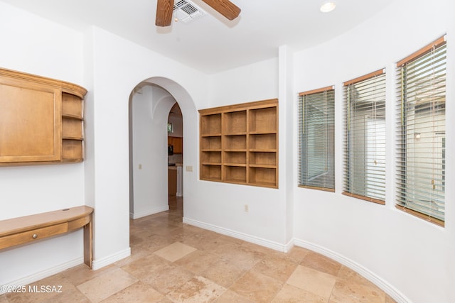 unfurnished room featuring ceiling fan