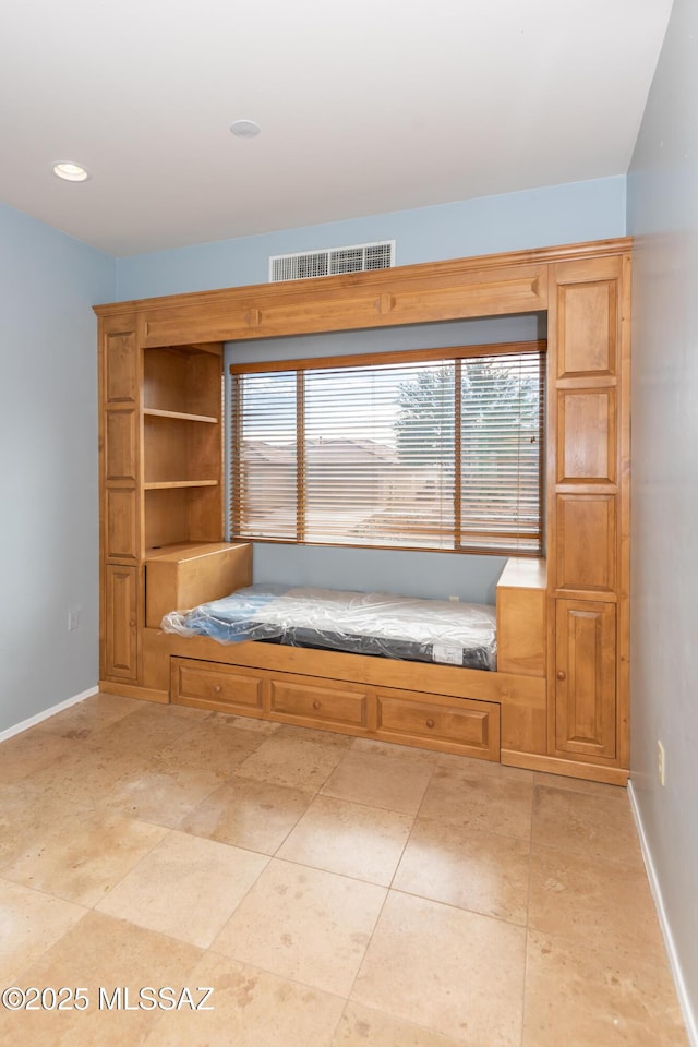 unfurnished room featuring plenty of natural light