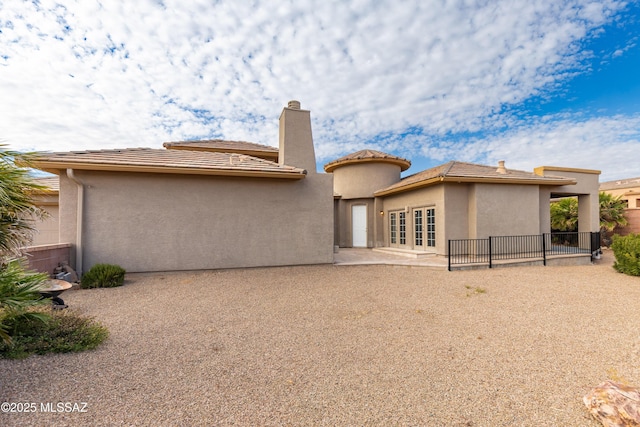 back of property featuring a patio area