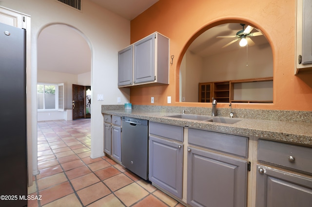 kitchen featuring gray cabinetry, stainless steel appliances, sink, ceiling fan, and light tile patterned floors