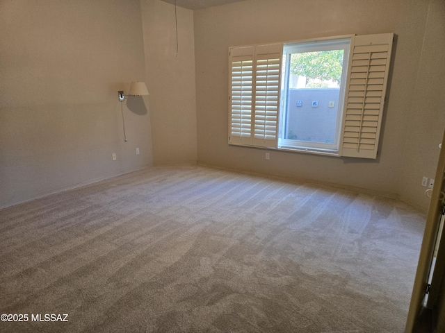 unfurnished room featuring carpet