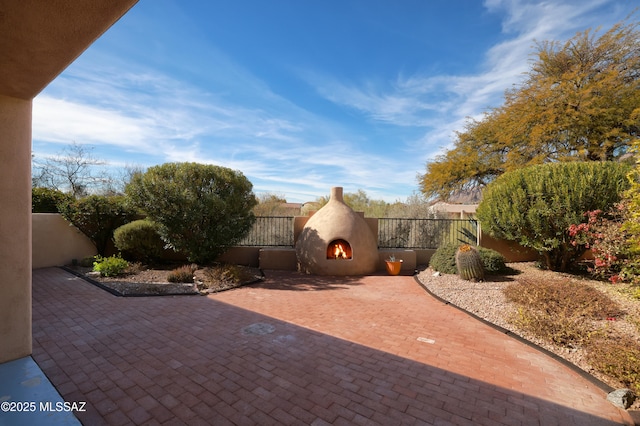 view of patio / terrace featuring an outdoor fireplace