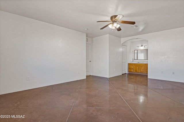 spare room with ceiling fan