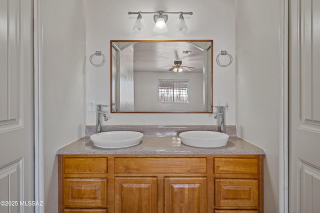 bathroom featuring ceiling fan and vanity