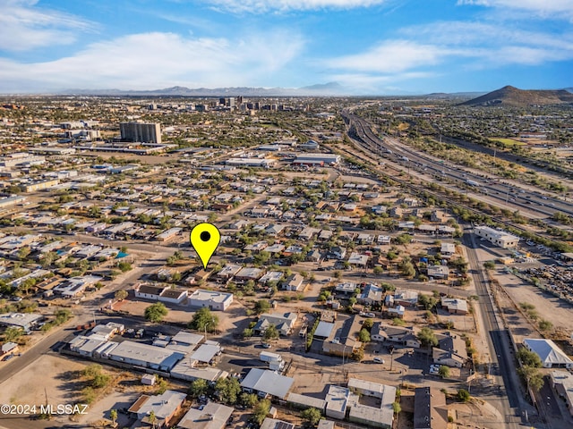 birds eye view of property with a mountain view