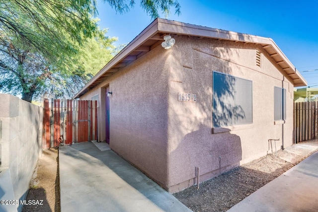 view of property exterior with a patio