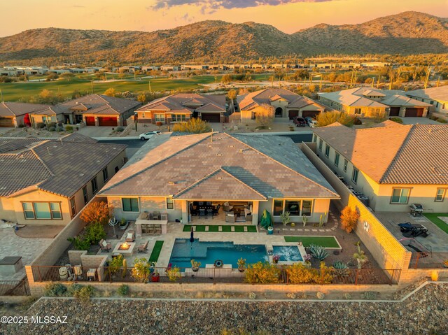 view of front facade with a garage and a mountain view