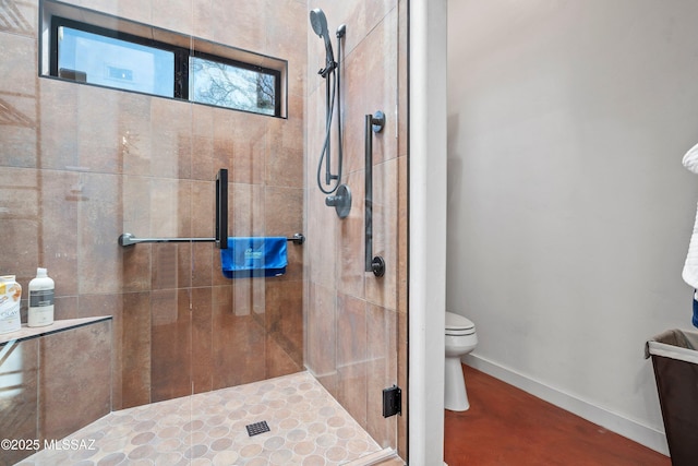 bathroom with an enclosed shower and toilet