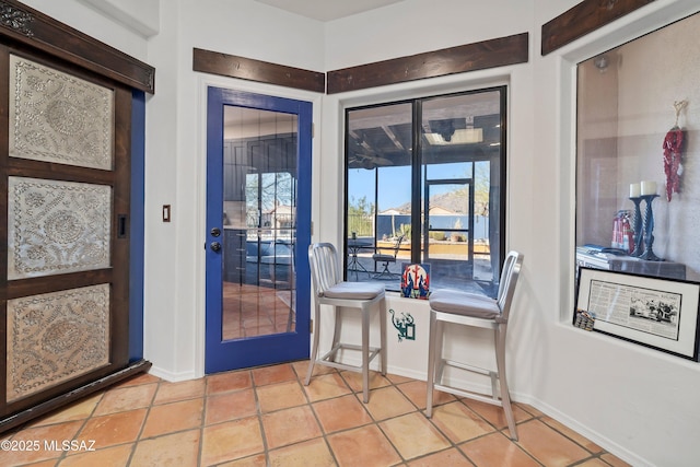 entryway featuring light tile patterned floors