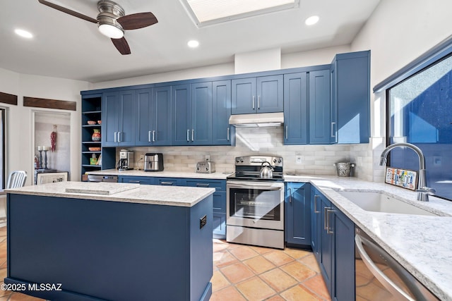 kitchen with sink, a center island, ceiling fan, blue cabinetry, and appliances with stainless steel finishes