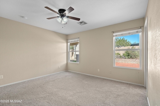 carpeted empty room with ceiling fan