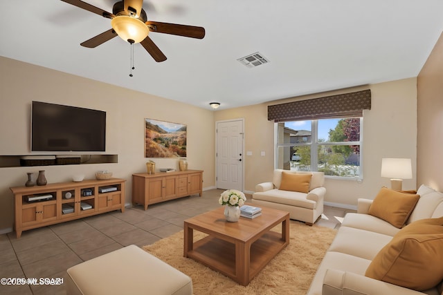 tiled living room with ceiling fan