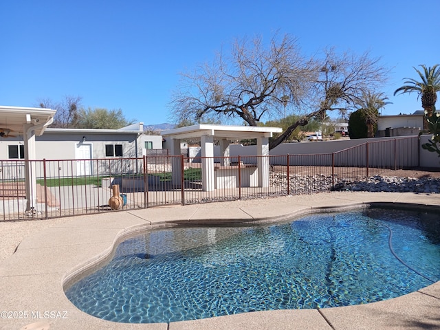 view of pool featuring a gazebo, a patio area, fence, and a fenced in pool