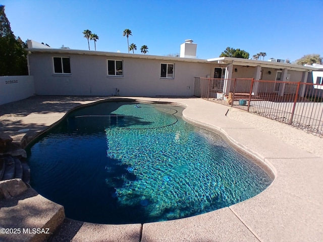 view of pool featuring fence, a fenced in pool, and a patio