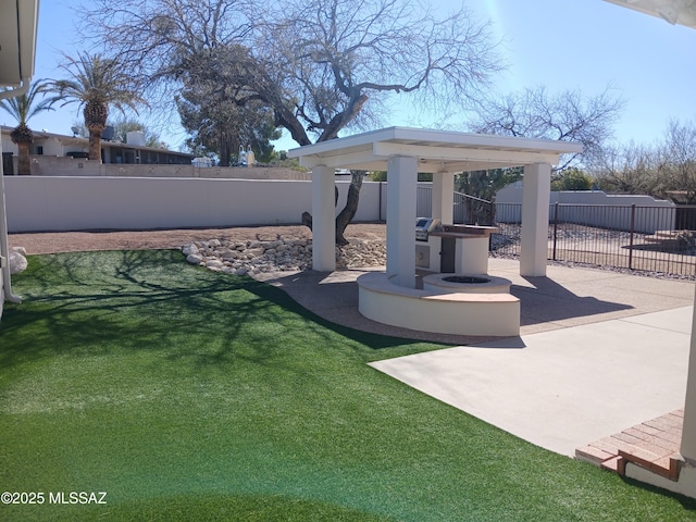 view of yard with a patio area, a fenced backyard, and a gazebo