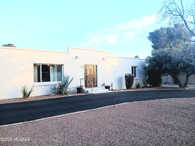 view of front of house featuring stucco siding