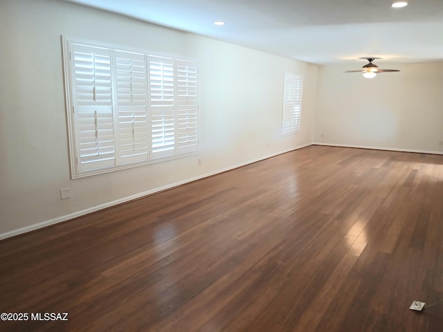 spare room with ceiling fan, baseboards, dark wood-style flooring, and recessed lighting