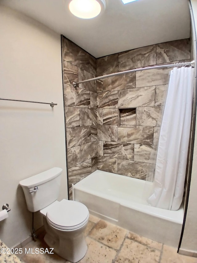 full bathroom with toilet and shower / tub combo with curtain