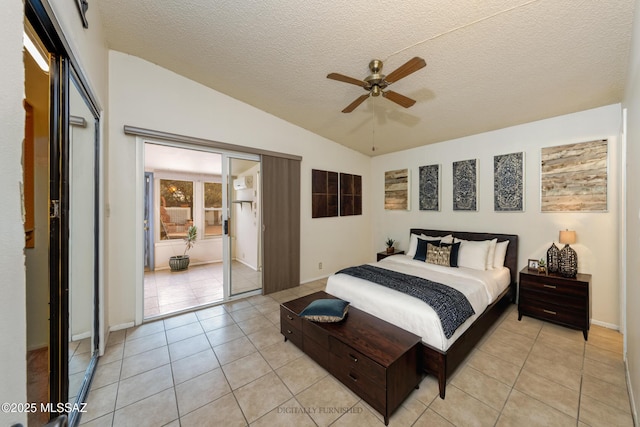 bedroom with access to exterior, vaulted ceiling, a textured ceiling, and light tile patterned flooring