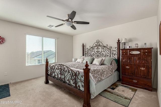 bedroom with light carpet and ceiling fan