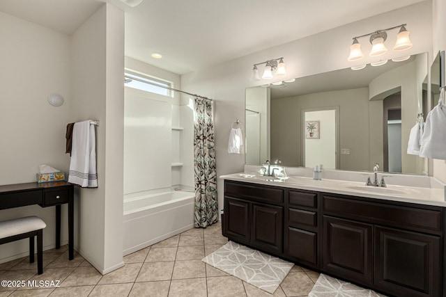 bathroom with tile patterned floors, shower / bath combo with shower curtain, and vanity