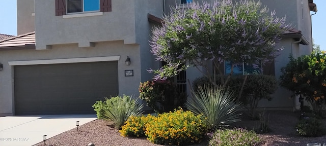 view of property exterior with a garage