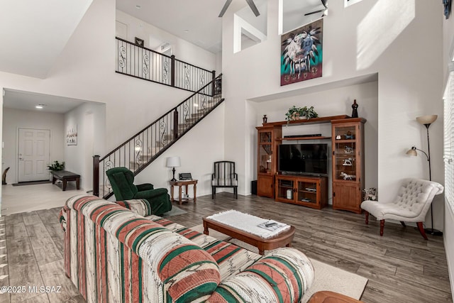 living room featuring a towering ceiling