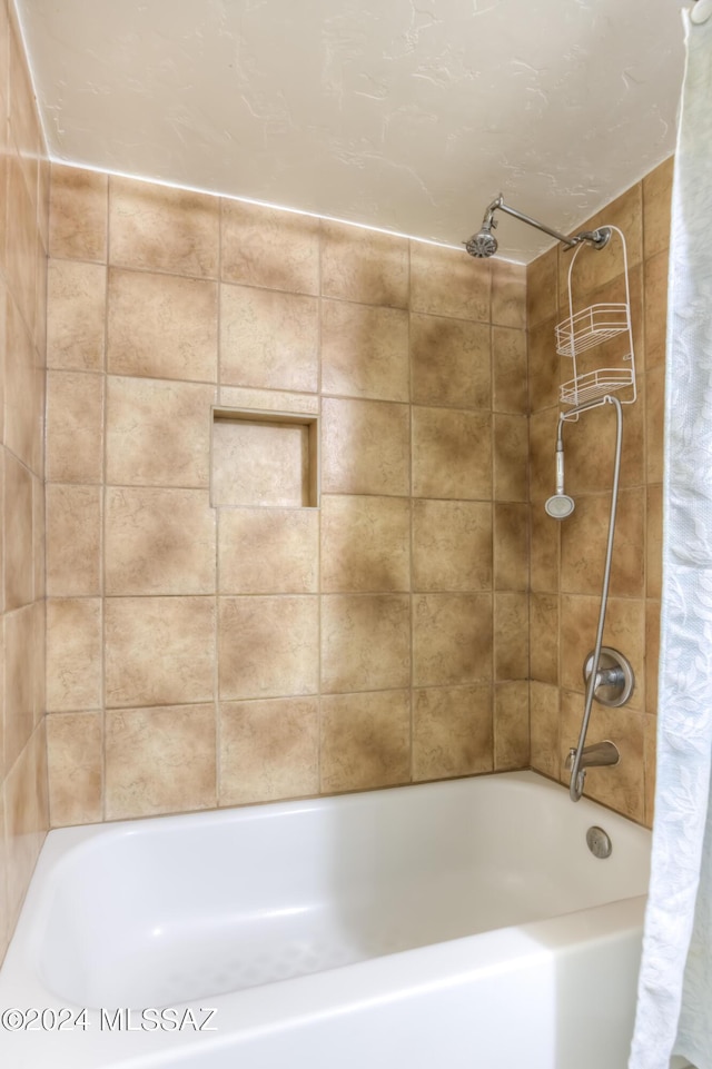 bathroom with shower / tub combo