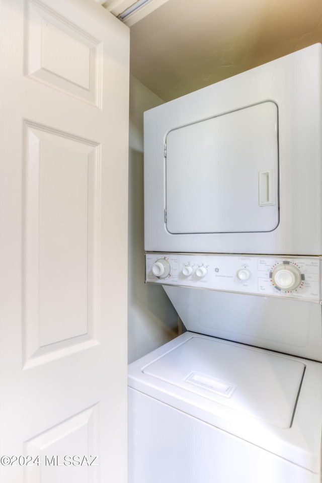 laundry room featuring stacked washer and dryer