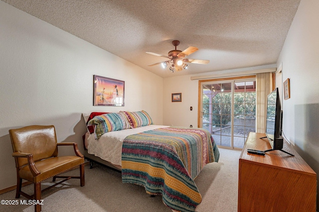 bedroom featuring a textured ceiling, carpet, access to exterior, and ceiling fan