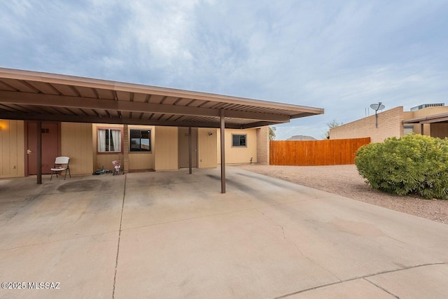 exterior space with a carport