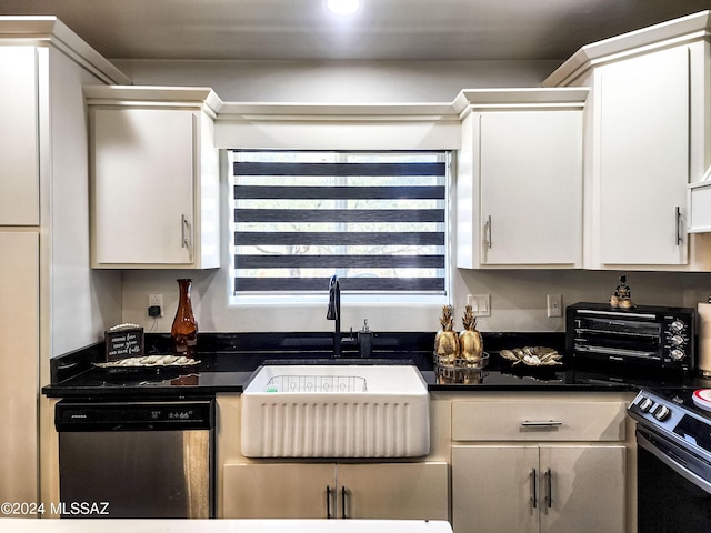 kitchen with electric range, dishwasher, and white cabinetry