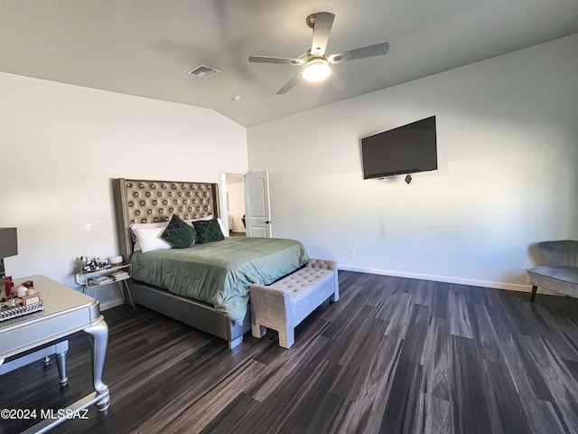 bedroom featuring ceiling fan, dark hardwood / wood-style flooring, and vaulted ceiling