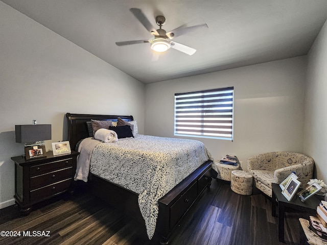 bedroom featuring ceiling fan and dark hardwood / wood-style floors