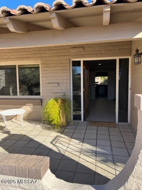 doorway to property featuring a patio