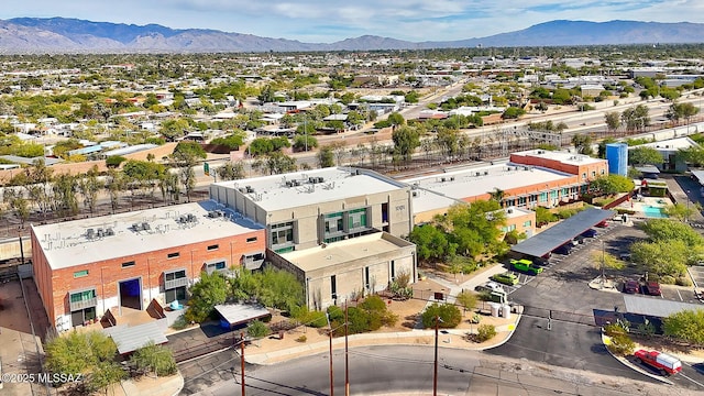 birds eye view of property with a mountain view