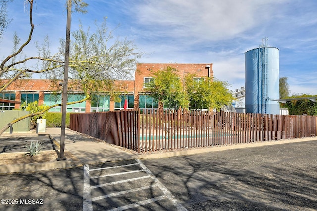 view of front of home featuring a swimming pool