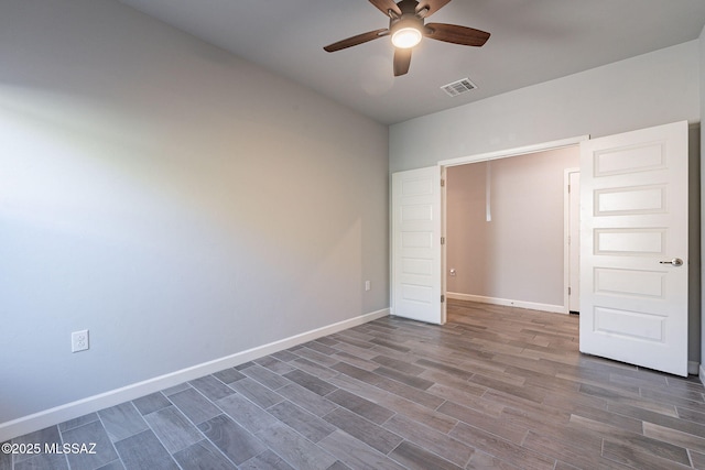 unfurnished bedroom featuring ceiling fan and hardwood / wood-style floors