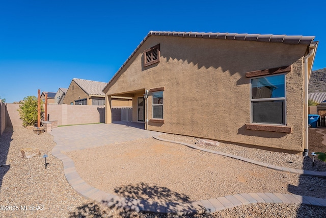 rear view of house with a patio area