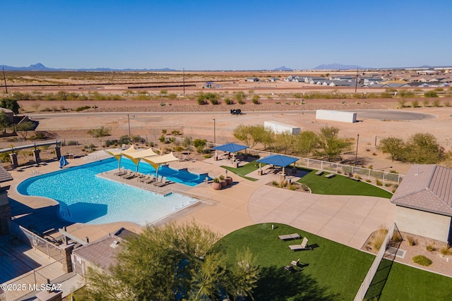 view of pool with a patio area and a mountain view