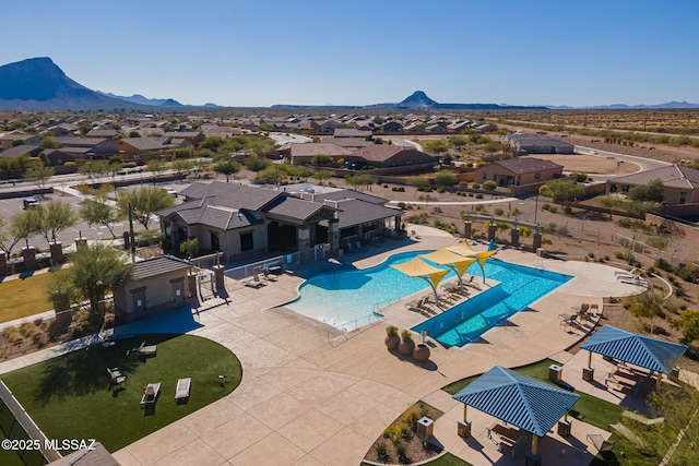 view of pool with a patio, a mountain view, and a gazebo