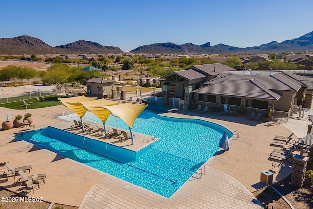 view of pool with a patio area and a mountain view