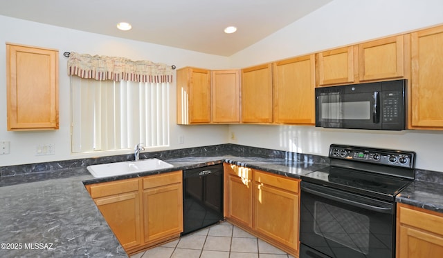 kitchen featuring black appliances, sink, vaulted ceiling, dark stone countertops, and light tile patterned flooring