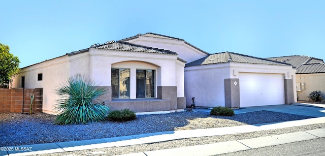 mediterranean / spanish-style home with a garage