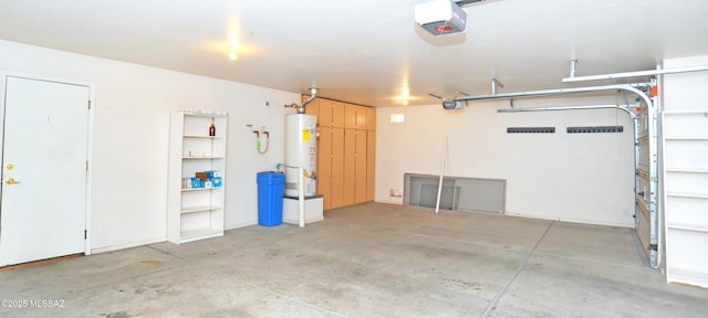 garage featuring a garage door opener and water heater