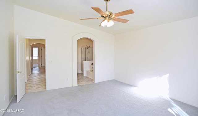 empty room featuring light carpet and ceiling fan