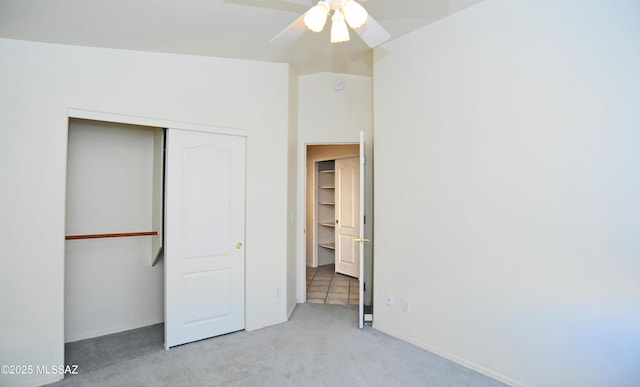 unfurnished bedroom featuring ceiling fan, a closet, and light carpet