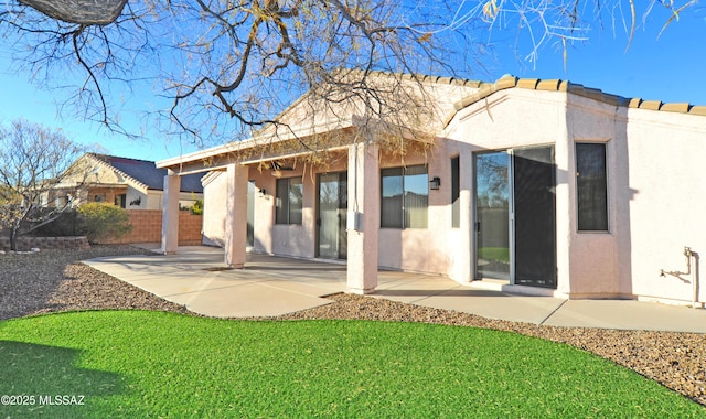 back of property featuring a patio