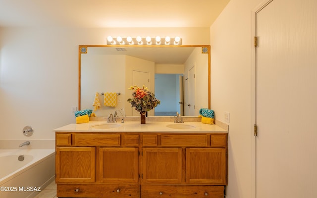 full bath featuring double vanity, a garden tub, visible vents, and a sink